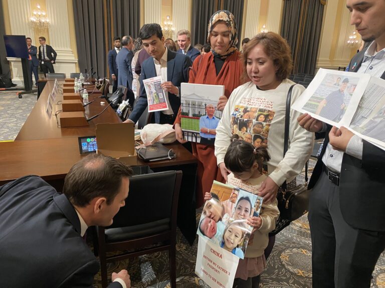 Mike Gallgher with Uyghurs