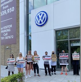 Uyghur supporters protest against VW: Souirce Stop Uyghur genocide